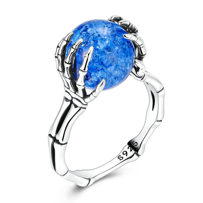 Skeleton Hand Holding A Bead Ring